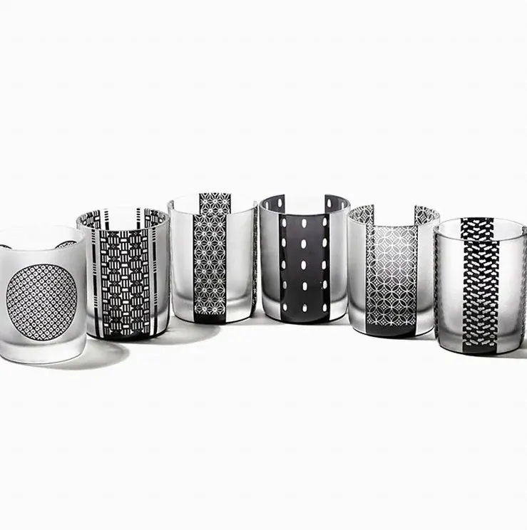 Row of Edo komon engraved tumblers in six black and white patterns
