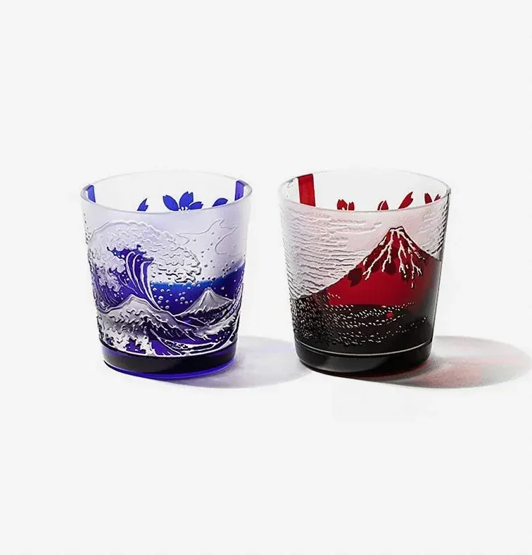 Pair of engraved cups, one with a blue Great Wave and one with a red Mount Fuji