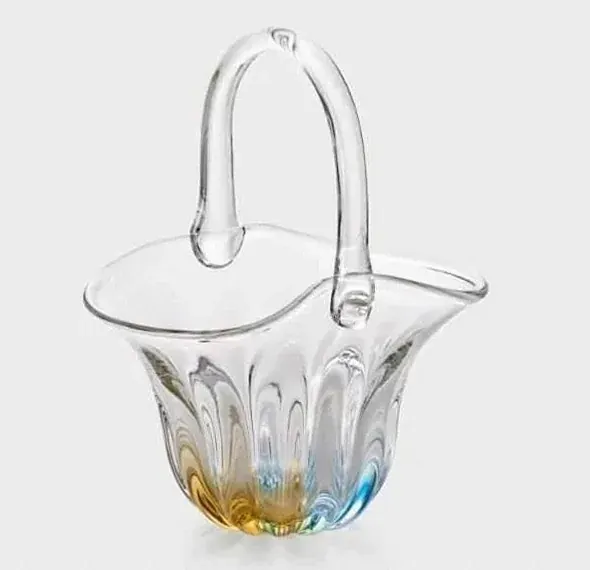 Clear glass basket-shaped vase with a handle and a blue and amber base